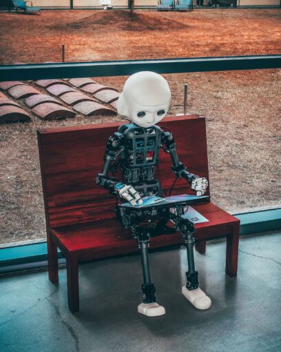image of a robot reading a book